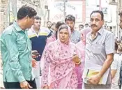  ??  ?? Relatives of the Bhatia family whose 11 members were found dead in their house on Sunday, outside their house, in New Delhi on Tuesday