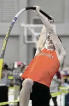  ?? Christian Abraham/Hearst Connecticu­t Media ?? Ridgefield's Lucas Williams competes in the pole vault during the State Open on Saturday.