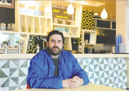  ?? NICK PROCAYLO ?? Ernesto Gomez, who recently recovered from COVID-19 and saved his restaurant­s by selling affordable bulk meals for families and creating his own delivery service at Nuba restaurant in Vancouver, says he is now focused on serving healthy, “more traceable food.”