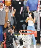  ?? WILFREDO LEE AP ?? Heat center Bam Adebayo makes the winning 13-foot jumper over Nets forward Jeff Green on Sunday.