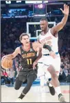  ??  ?? Atlanta Hawks guard Trae Young (11) drives to the basket against New York Knicks forward Noah Vonleh (32) during the first half of an NBA basketball game on Oct 17 at Madison Square Garden in NewYork. (AP)