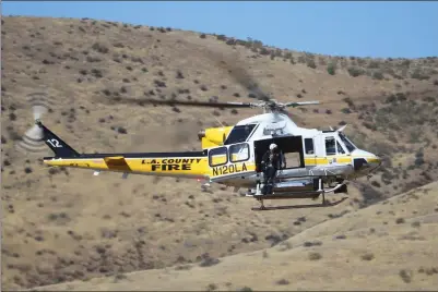  ?? Jeff Zimmerman/For The Signal ?? A Los Angeles County Fire Department helicopter works to transport a victim of a crash crash to Henry Mayo Newhall Hospital on Friday.