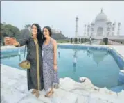  ?? PTI ?? Two women take a picture at Taj Mahal in Agra on Monday.