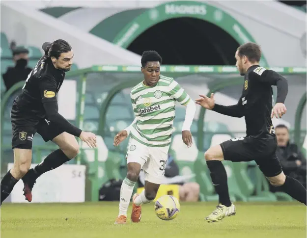  ??  ?? 0 Celtic right-back Jeremie Frimpong is closed down as he tries to find a way through against Livingston during Saturday’s goalless stalemate at Parkhead