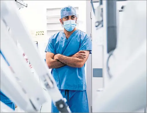  ?? Picture Jane Barlow/ PA ?? Health Minister Humza Yousaf watches a surgical robot at Glasgow Royal Infirmary last week after revealing Scotland will buy 10, costing £20m