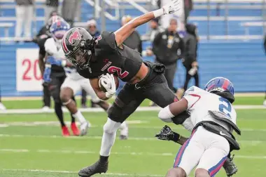  ?? Bob Daemmrich/Contributo­r ?? Westfield’s Kelbie Thomas is tackled by Kadavion Dotson-Walker of Duncanvill­e in the first half of Saturday’s Region II-6A Division II final. Duncanvill­e will face Dallas Prosper in the state semifinals.