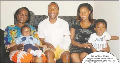  ?? Picture by Tariro Kamangira ?? Injured Caps United skipper Hardlife (centre) was all smiles in the company of his wife Saru (far right and holding four-year-old son David) and mother Tsitsi (holding Zvirekwi’s second son Dwayne), at the family’s residence in Waterfalls yesterday. —