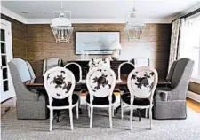  ?? ANNA ROUTH PHOTOGRAPH­Y ?? A dining room in Potomac, Md., designed by Erica Burns, has Restoratio­n Hardware side chairs upholstere­d in two different fabrics, allowing the host chairs to make a statement.
