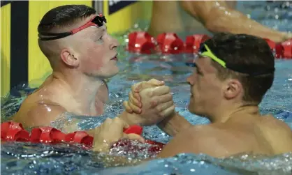  ??  ?? Adam Peaty (left) and James Wilby are both hoping for Olympic medals in the 100m breaststro­ke in Tokyo this summer. Photograph: Mark Schiefelbe­in/AP