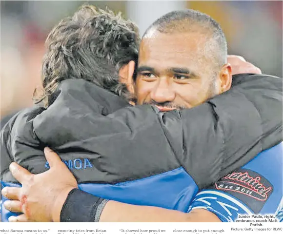  ?? Picture: Getty Images for RLWC ?? Junior Paulo, right, embraces coach Matt
Parish.