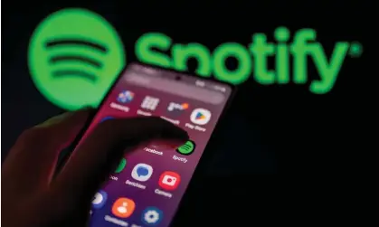  ?? Photograph: Jonathan Raa/NurPhoto/Shuttersto­ck ?? Spotify Premium subscriber­s in the UK and Australia can now access to up to 15 hours of audiobook content per month