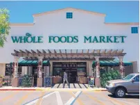  ?? CHARLIE MOORE/JOURNAL ?? Amazon is rolling out a program giving Prime members new discounts at its Whole Foods Markets. This store is at Wyoming and Academy NE.