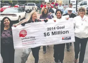  ??  ?? Hundreds helped to kick off the 2014 Community Campaign and announce the goal
of $6 Million. L-R: Anu Kashyap, Lea Pennock, Jo Custead, Sheri Benson