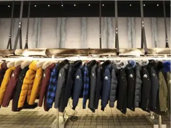  ?? RICHARD LAUTENS PHOTOS/TORONTO STAR ?? Ryerson design grads Mark Peros and Will Poho debuted the first coats in fall 2009, and they sold well.