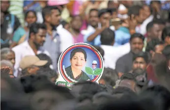  ?? AFP ?? Indian supporters gather to pay their respects to Tamil Nadu chief minister J Jayalalith­aa as she lay in state before her funeral at Rajaji Hall in Chennai on December 6 last year
