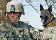  ??  ?? Air Force staff sergeant Justin Kitts and his faithful canine companion on duty in Afghanista­n