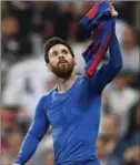  ?? DAVID RAMOS, GETTY IMAGES ?? Soccer superstar Lionel Messi celebrates after scoring FC Barcelona’s third goal during the La Liga match against Real Madrid CF on Sunday.