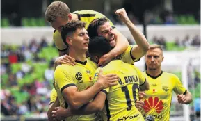  ?? PHOTO: GETTY IMAGES ?? Yes! Phoenix players celebrate Ulises Davila’s goal during their Round 5 ALeague match against Melbourne Victory, in Melbourne yesterday.