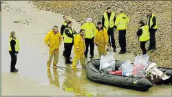  ??  ?? UK LANDING: Migrant dinghy is examined at Lydd on New Year’s Day, above.Natanz nuclear facility in Iran, below