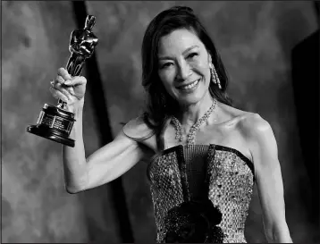  ?? EVAN AGOSTINI / INVISION / AP ?? Michelle Yeoh, winner of the Oscar for best actress, arrives Sunday at the Vanity Fair Oscar Party at the Wallis Annenberg Center for the Performing Arts in Beverly Hills, Calif.