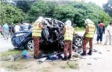  ??  ?? The wrecked vehicle of the victims at the scene of collision involving a trailer and three vehicles at the Jalan Baling-Kuala Kangsar crossroad traffic light junction, yesterday.