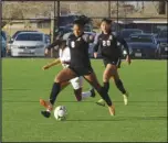  ?? MERISA JENSEN Valley Press ?? CLEARED
A Palmdale Aerospace Academy player clears the ball away from a Schurr player as the Griffins’ Cihomara Esquivel (20) looks on.