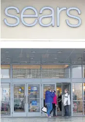  ?? AP ?? In this photo taken on March 25, 2017, shoppers enter the Sears department store in Schaumburg, Illinois.