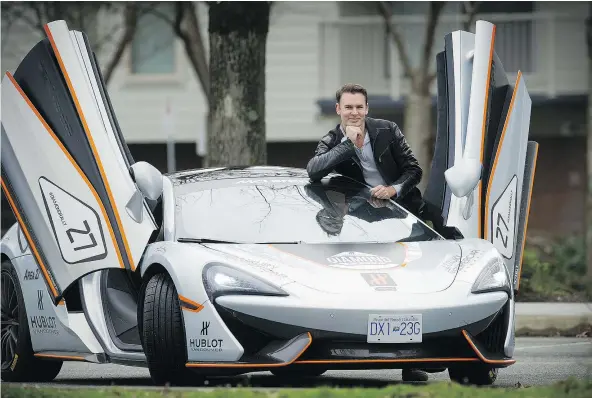  ?? MARK VAN MANEN/PNG ?? White Rock’s Robbie Dickson poses with a McLaren 570 GT, which runs a cool $380,000.