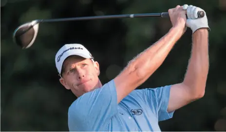  ?? CP PHOTO ?? David Hearn of Canada tees off on the 10th hole of at the Canadian Open golf tournament at Glen Abbey in Oakville, Ont. on Thursday.