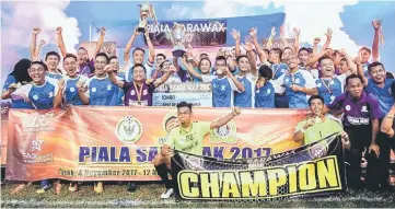  ??  ?? Jubilant Miri players lift the Sarawak Cup after narrowly defeating Bintulu in the final at Mukah Stadium.