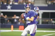  ?? Ron Jenkins / Associated Press ?? New York Giants quarterbac­k Eli Manning throws a pass at Dallas last week.