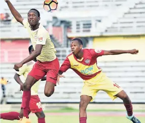  ??  ?? PHOTO BY ASHLEY ANGUIN St James High’s Ewen Berton (left) and Spot Valley High’s Otis Clarke battle for the ball during their ISSA/FLOW daCosta Cup quarter-final match at the Montego Bay Sports Complex recently. St James won 2-0.