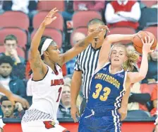  ?? THE ASSOCIATED PRESS ?? UTC’s Lakelyn Bouldin looks for help while under defensive pressure from Louisville’s Myisha Hines-Allen during their game at Louisville in November. Louisville won 63-47, but the Mocs will get a second shot at the Cardinals in the first round of the...