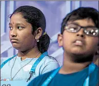  ?? Special to the Democrat-Gazette/PETE MAROVICH ?? Pavani Chittemset­ty (left), 12, from Bentonvill­e on Wednesday participat­es in the third round of the 2018 Scripps National Spelling Bee. Pavani and two others from Arkansas didn’t make it into today’s final round.