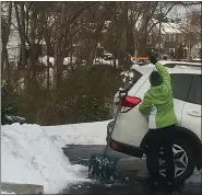  ?? SUBMITTED PHOTO ?? A West Norriton resident clears her car after the storm Thursday morning.