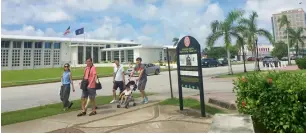  ?? AFP ?? People walk around Hagatna, the capital city of Guam, on Wednesday. —