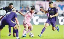  ?? (AP) ?? Inter Miami forward Lionel Messi (10) comes under pressure from Orlando City midfielder Cesar Araujo (5), right, and defender Kyle Smith (24), back left, during the second half of an MLS soccer match, Saturday, March 2, 2024, in Fort Lauderdale, Fla.