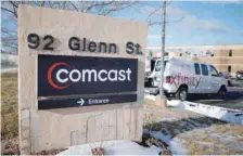  ??  ?? A sign marks a Comcast facility in Lawrence, Massachuse­tts. — Reuters