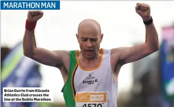  ??  ?? Brian Gurrin from Kilcoole Athletics Club crosses the line at the Dublin Marathon.