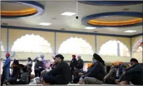  ??  ?? Men gather for prayers inside the Prayer Hall at Sikh Gurdwara San Jose on Feb. 9. The current 40-acre site opened in 2011and is worth an estimated $27million, accordng to Sikh Gurdwara President Bhupinder Dhillon.