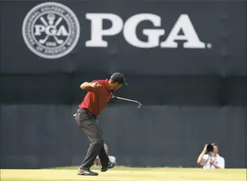  ?? Jeff Roberson/Associated Press ?? Tiger Woods’ dramatic charge, including this birdie putt on the 18th green Sunday, fell short but impressed Ryder Cup captain Jim Furyk.