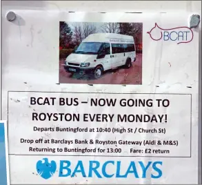  ??  ?? WHAT A CHEEK: A poster taped on the window of the closed bank advertises a subsidised minibus service to Royston, taking over two hours