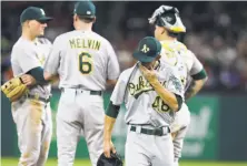  ?? LM Otero / Associated Press ?? A’s pitcher Daniel Gossett was pulled from the game against the Rangers after allowing four runs in the second inning.