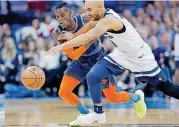  ?? PHIPPS, THE OKLAHOMAN] [PHOTO BY SARAH ?? Oklahoma City’s Dennis Schroder, left, contends for a loose ball against Minnesota’s Jerryd Bayless during Sunday’s game at Chesapeake Energy Arena.
