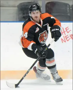  ?? NEWS PHOTO RYAN MCCRACKEN ?? Medicine Hat Tigers alternate captain Ryan Jevne turns and looks for a pass in the offensive zone during the first period of Wednesday’s Western Hockey League game against the Red Deer Rebels at the Canalta Centre.