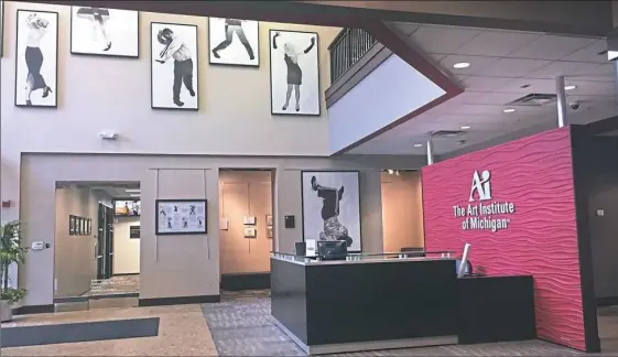  ?? Daniel Moore/Post-Gazette ?? The empty lobby, with student work still displayed on the walls, at the soon-to-close Art Institute of Michigan in Novi, Mich., on July 27. The school opened in 2008 and has taught hundreds of students from suburban Detroit in the fields of creative studies, including animation, graphic design, culinary arts, fashion and photograph­y.