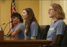  ?? Abbie Parr/Associated Press ?? Lucia Everist, of Climate Generation, center, speaks to the Minnesota Youth Council in February in St. Paul, Minn. The council is a liaison between young people and lawmakers to support a bill to teach more about climate change.