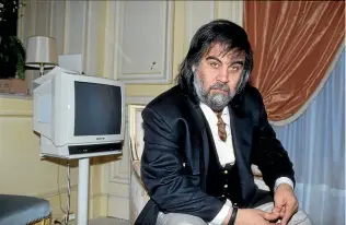  ?? GETTY IMAGES ?? Vangelis in his Paris apartment in 1991. His Oscar-winning theme for Chariots of Fire remains one of the most recognisab­le – and parodied – in film music history.