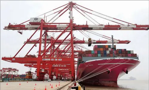  ?? ?? A container ship from Japan is anchored at the container dock of Shanghai’s Yangshan Port in east China on April 27, 2022.