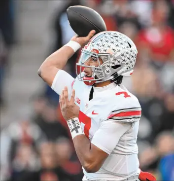  ?? Nick Wass The Associated Press ?? Ohio State quarterbac­k C.J. Stroud is in the driver’s seat for the Hesiman Trophy and could easily be the top pick in the 2023 NFL draft.